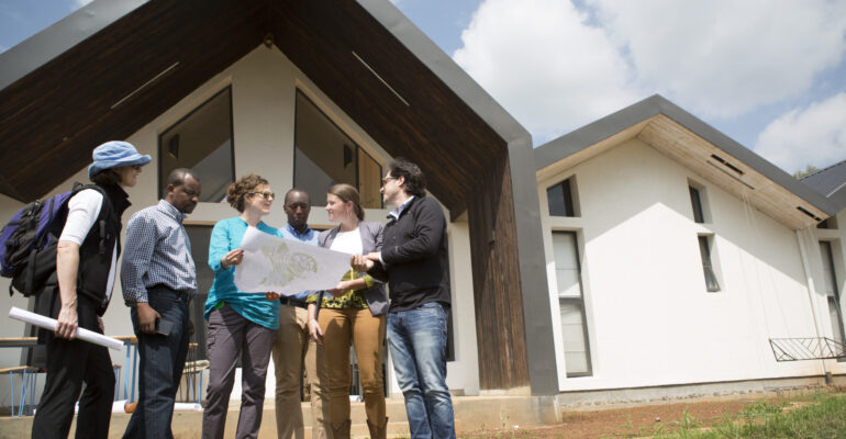 Dr. Peter Drobac and representatives of Bill & Melinda Gates Foundation, Inshuti Mu Buzima, and MASS Design Group.